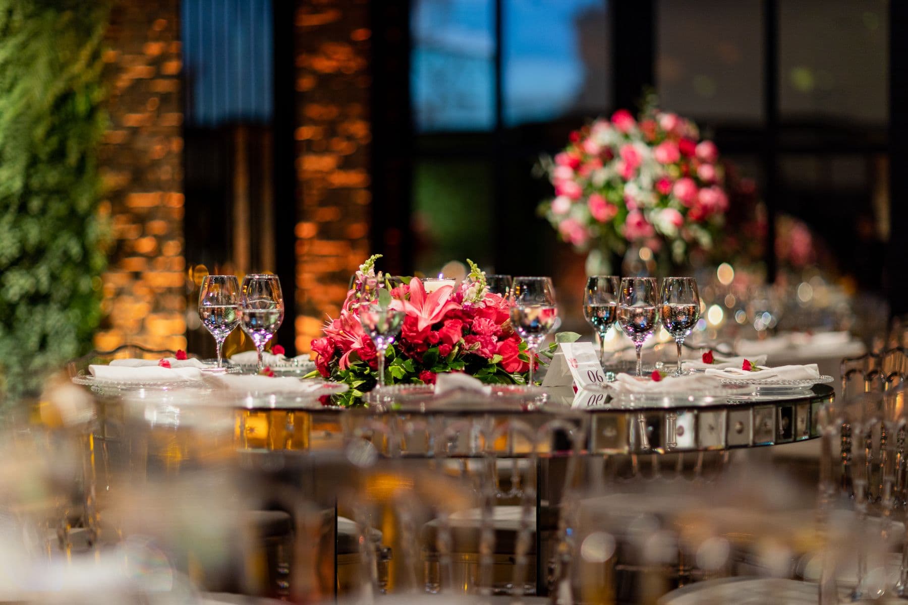 Round tables with floral centerpieces at a reception